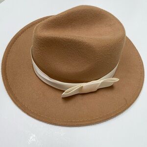 Beige hat with white bow
